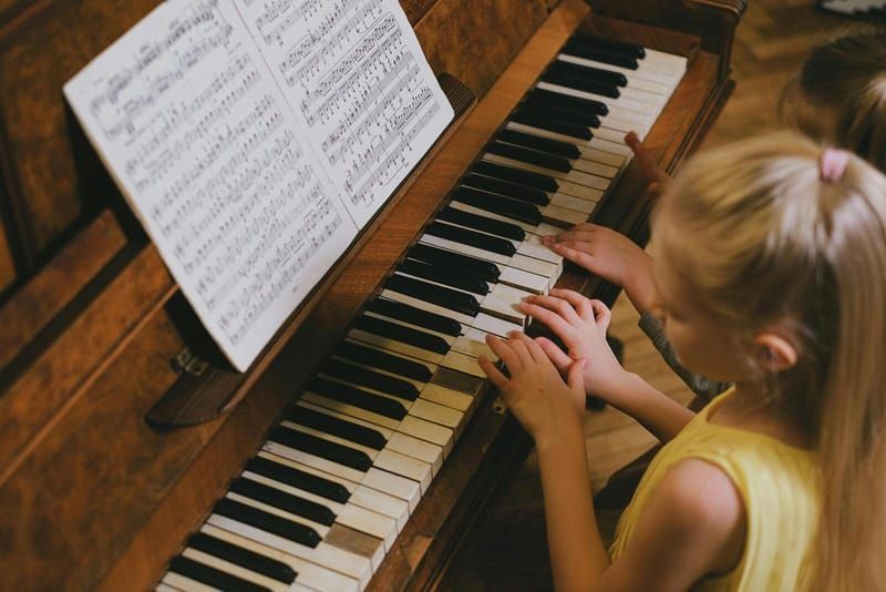 Young girl playing piano